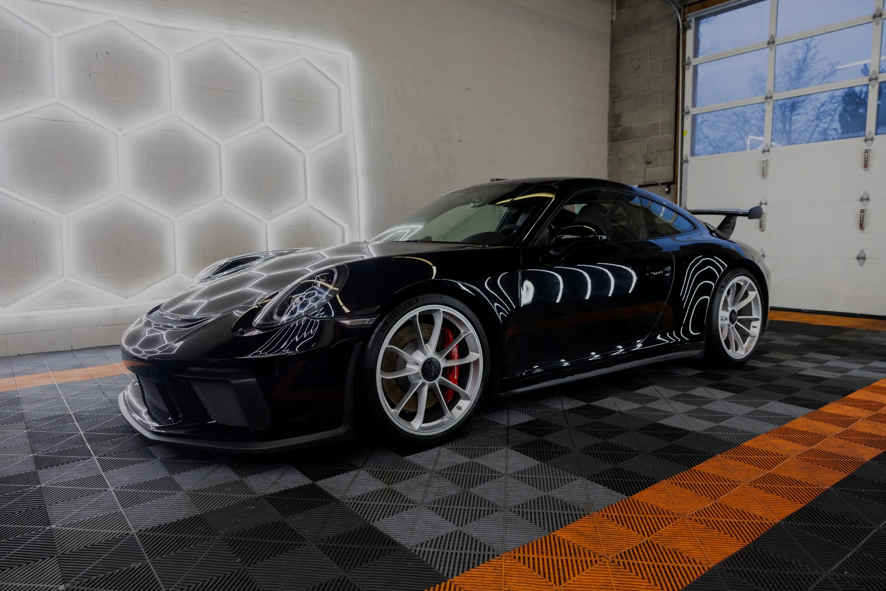 Porsche 911 GT3 side profile on the checker floor