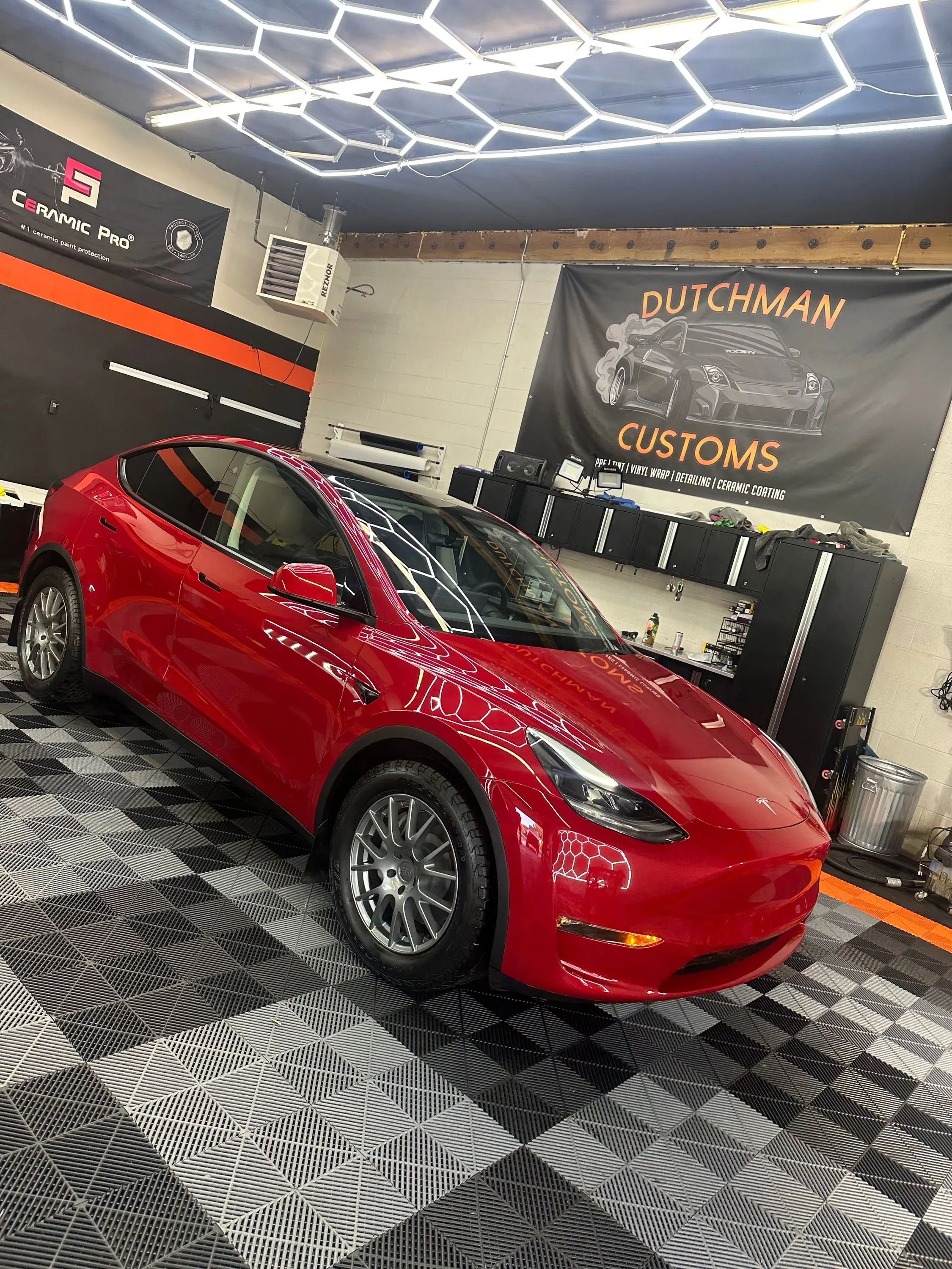 Red Tesla Model Y in the bay