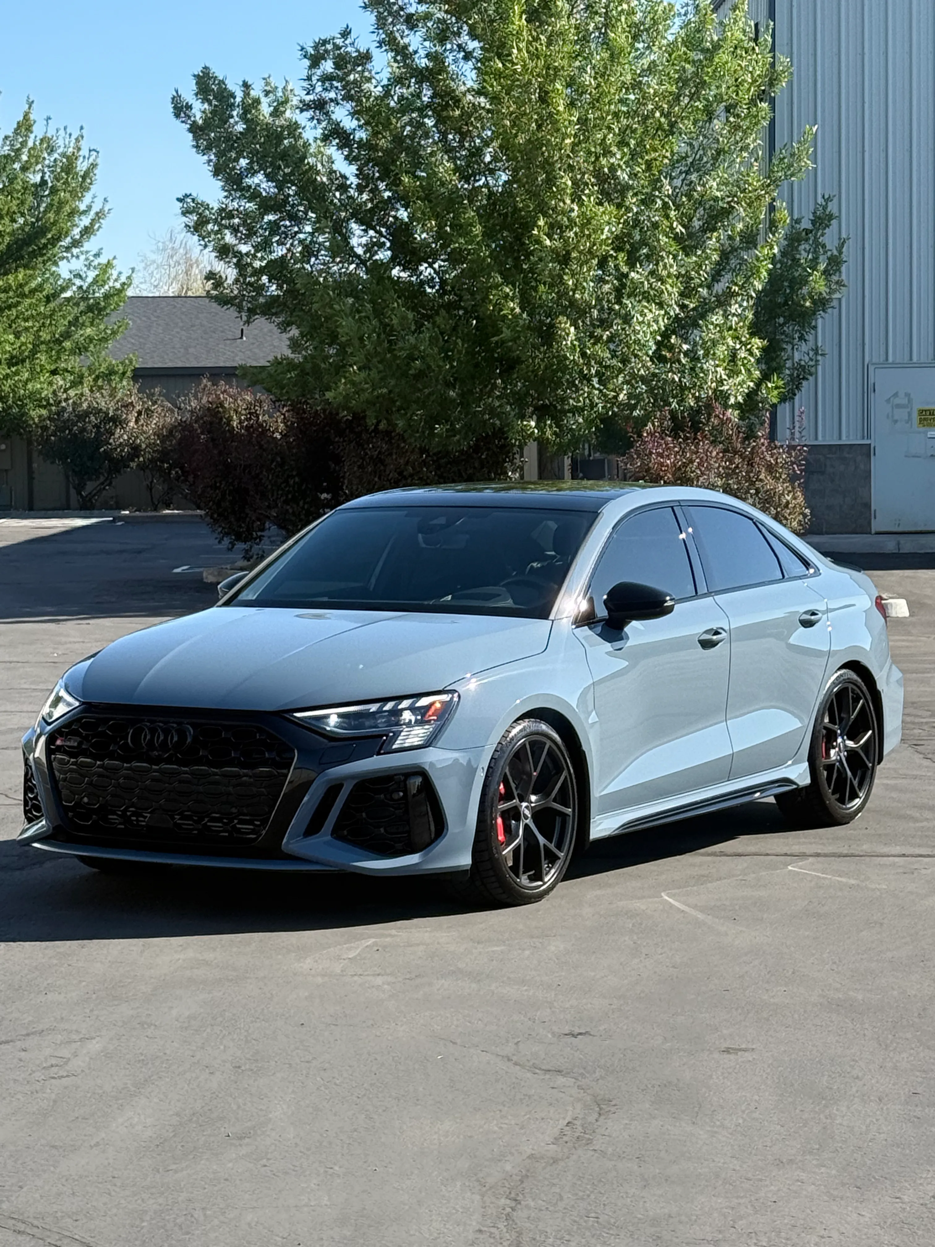 Light blue Audi RS3 outside