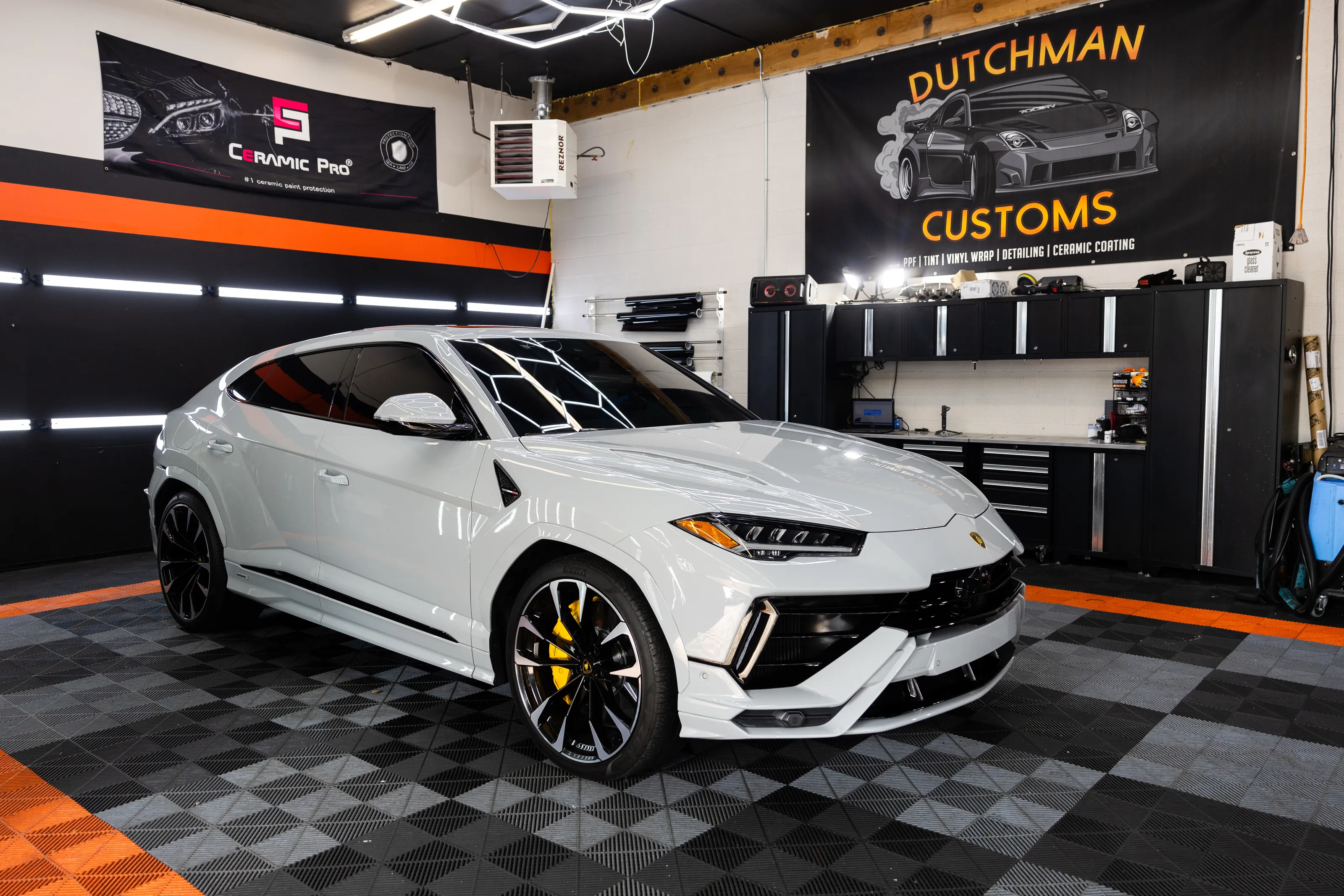 White Lamborghini Urus parked in the bay